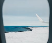 Aerial view of the rugged, volcanic coastline of Tristan da Cunha, the world's most remote inhabited island.