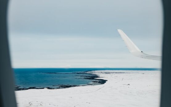 Aerial view of the rugged, volcanic coastline of Tristan da Cunha, the world's most remote inhabited island.