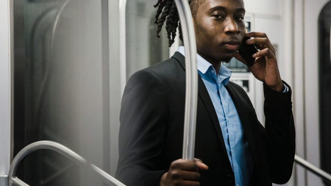 A manager and an employee sitting across from each other at a desk, engaged in a serious discussion about performance.