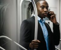 A manager and an employee sitting across from each other at a desk, engaged in a serious discussion about performance.