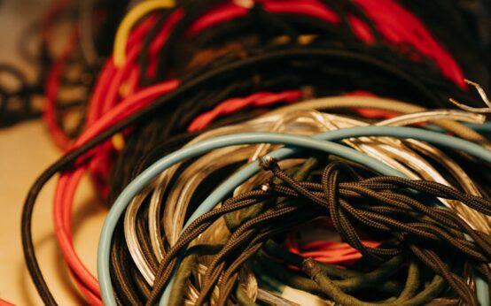 An abstract digital representation of a quantum computing network with glowing nodes and interconnected lines.