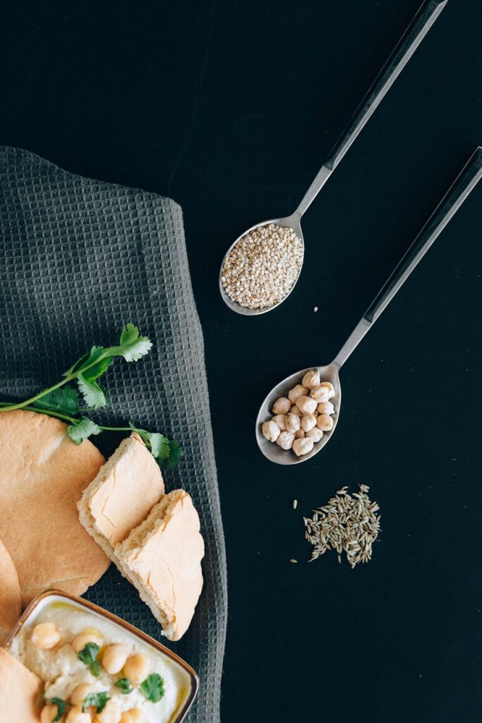 A smiling person chopping fresh vegetables on a cutting board in a bright, clean kitchen, preparing a wholesome meal.
