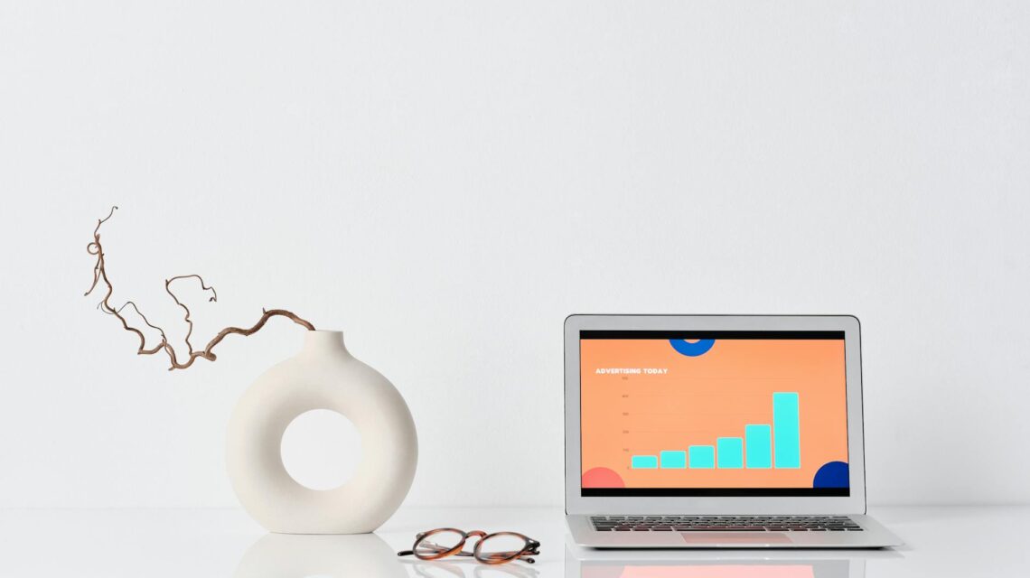 A data scientist with glasses analyzing complex data visualizations on a large monitor in a modern office.