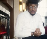 A person working from home, earning money online with their laptop and phone.