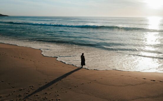 The Roman Colosseum bathed in the soft golden light of sunrise with no crowds in sight.