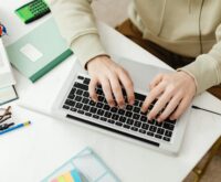 A tutor conducting an online session from their comfortable home office setup.