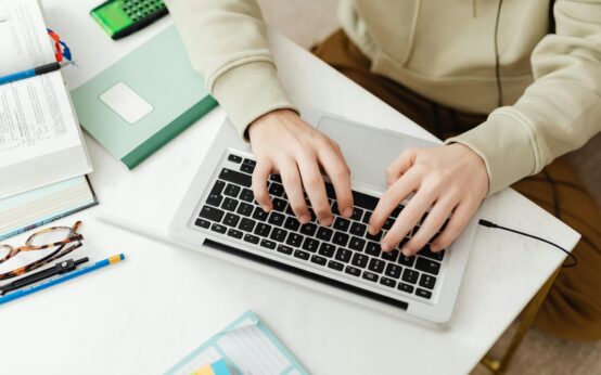 A tutor conducting an online session from their comfortable home office setup.
