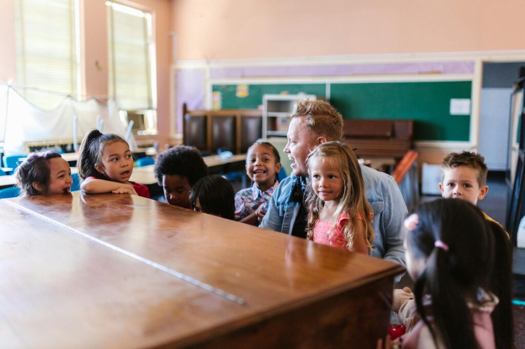 A diverse group of engaged students gathered around a historical display in a museum.